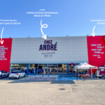 Façade extérieure avec toile Slimbox effet briques et lettres boîtiers installée par LightAir à Saint Bonnet de Mure pour le déploiement d'enseignes multi-sites des Boucheries André.